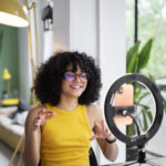 Influencer sitting in front of ring light