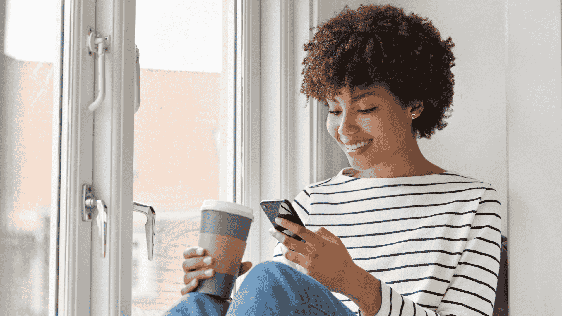Woman shopping on mobile phone and smiling