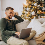 man shopping on laptop